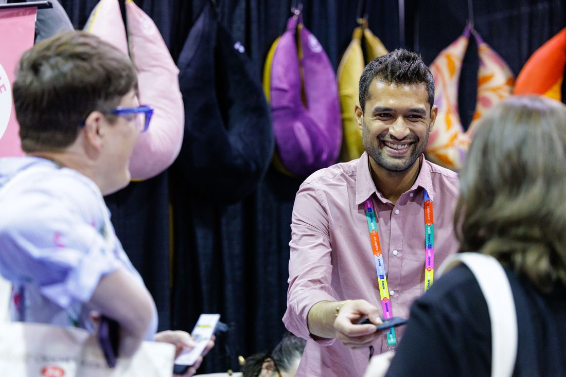 Exhibitor greeting a buyer